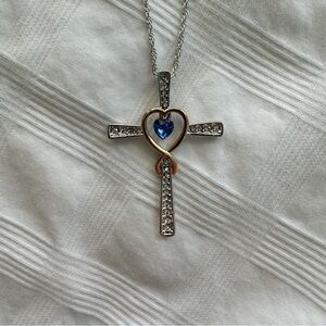 Elegant Silver and Gold Cross Necklace with Blue Heart